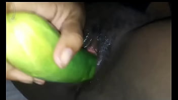 Lonely Girl Satisfying herself wit a big cucumber